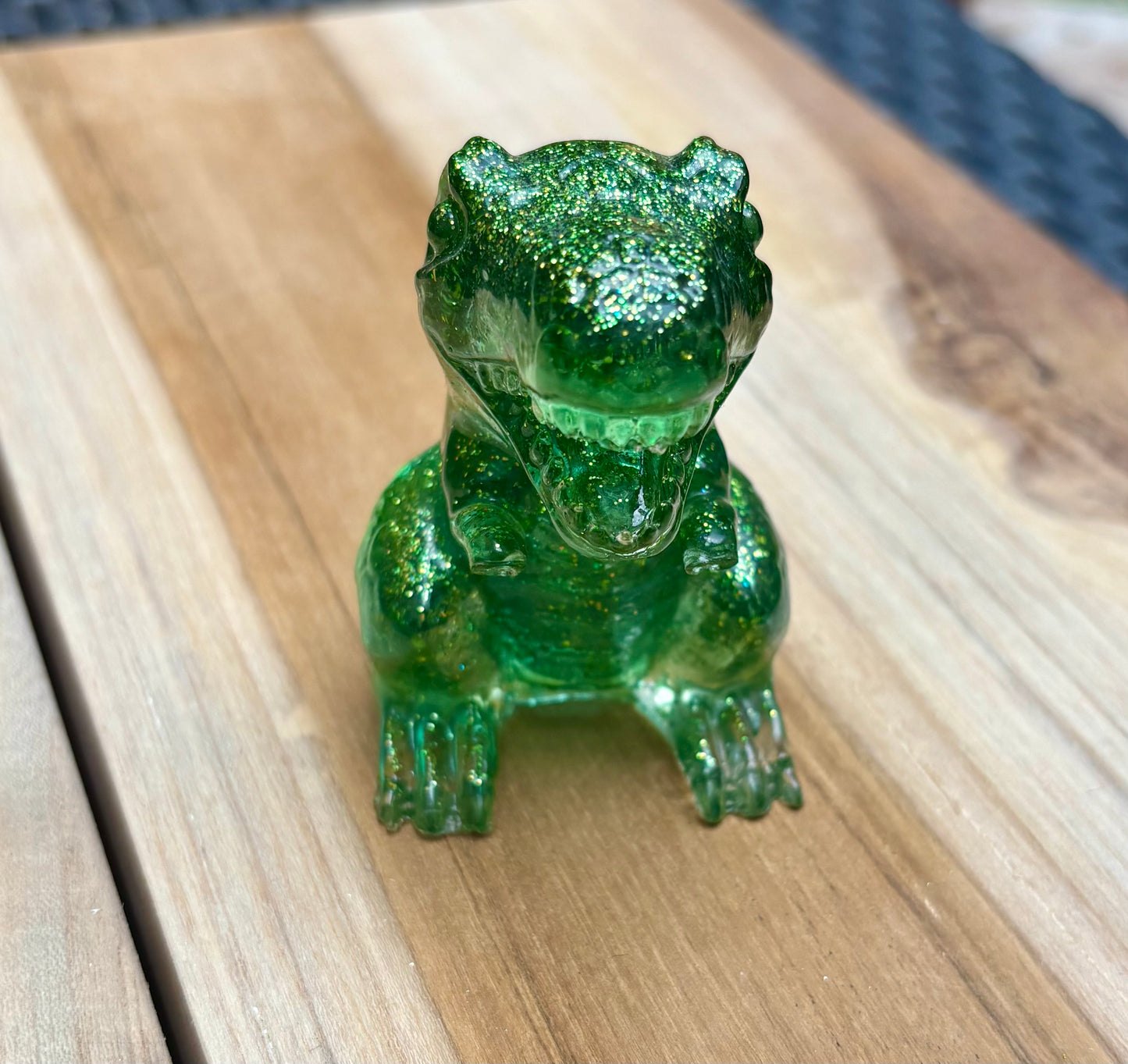 Figurine dinosaure vert à paillettes