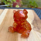Figurine ourson rouge et or