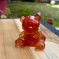 Figurine ourson rouge et or