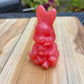Figurine lapin et sa peluche rose