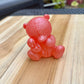 Figurine ourson et sa peluche rose