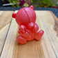 Figurine ourson et sa peluche rose