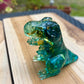Figurine dinosaure bleu et feuilles d’or