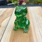 Figurine dinosaure vert à paillettes