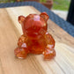 Figurine ourson rouge et or