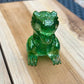 Figurine dinosaure vert à paillettes